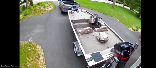 Backing the boat into the driveway after a fishing trip.